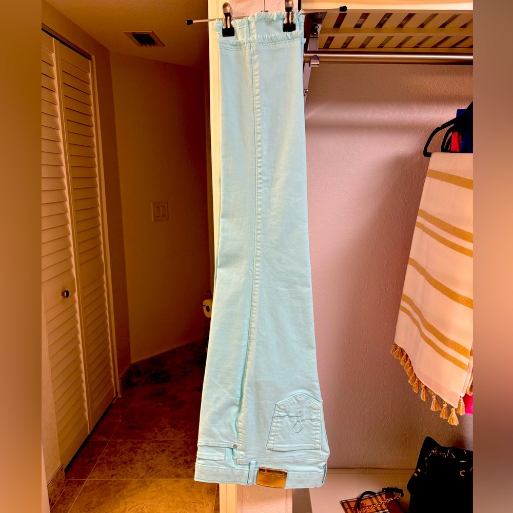 NWOT mint condition never worn colour is aqua